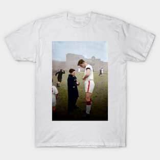 Duncan Edwards with young fan in colour T-Shirt